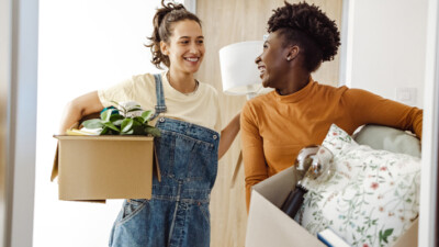 Two roommates moving into a college dormitory.