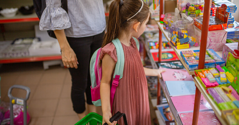 A student looking at school supplies.