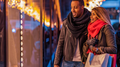 A man and a woman window shopping.