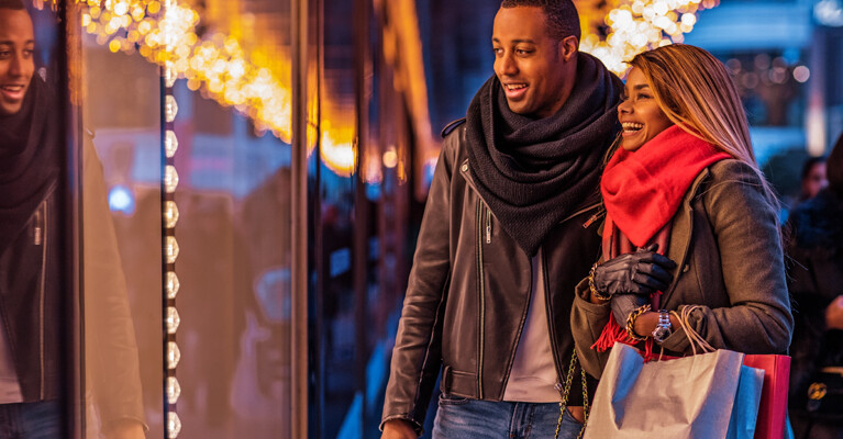 A man and a woman window shopping.