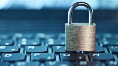 Padlock resting on a keyboard.