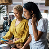 Two small business owners reviewing their finances.