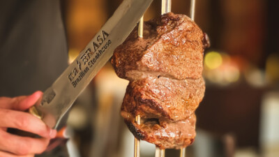 Piece of steak hanging at a Brazilian Steakhouse.