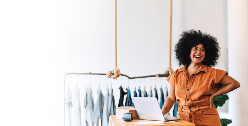 Small Business owner standing at her checkout counter in her shop.